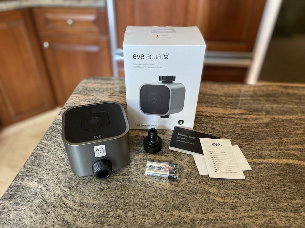 a photo of Eve Aqua Smart Water Controller unboxed on a countertop