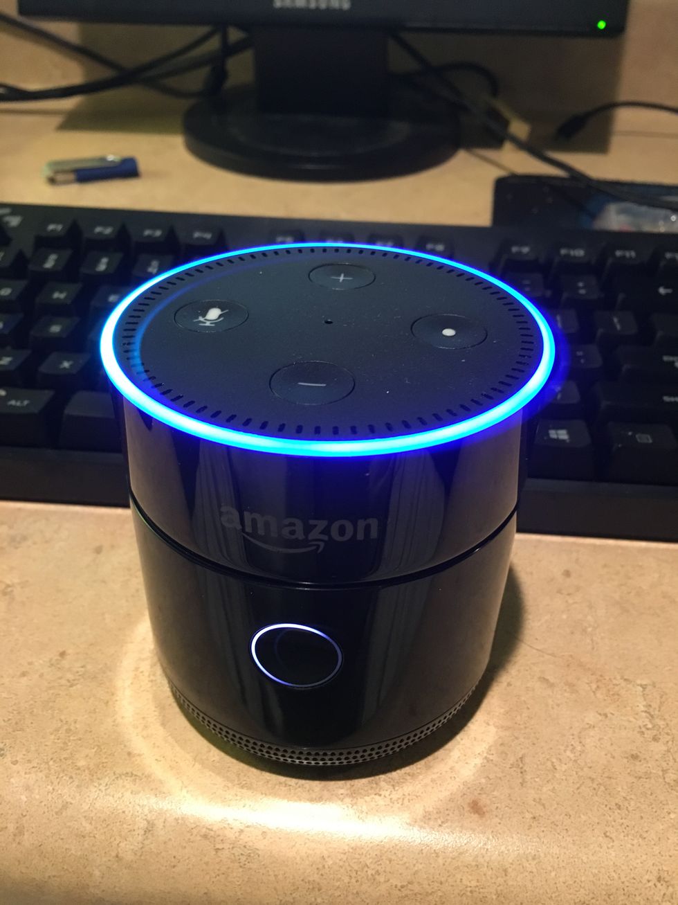 A photo of Fremo Evo underneath Amazon Echo Dot speaker
