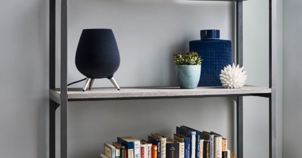 a photo of galaxy speaker on a book shelf