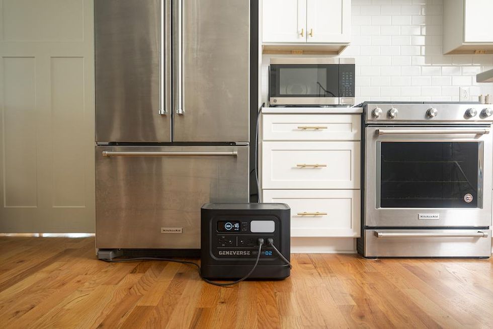 a photo of Geneverse indoor solar powered generator powering a refrigerator