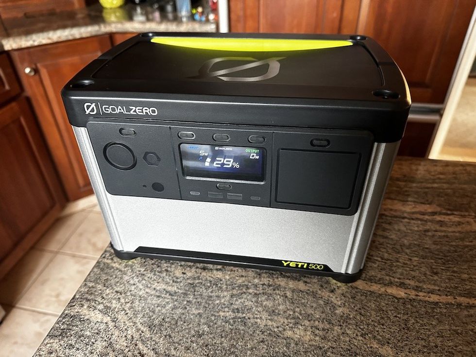 a photo of Goal Zero Yeti 500 Portable Power Station on a countertop charging