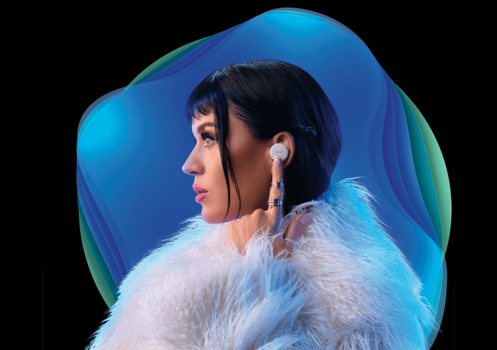 a photo of Katy Perry wearing Denon PerL Earbuds