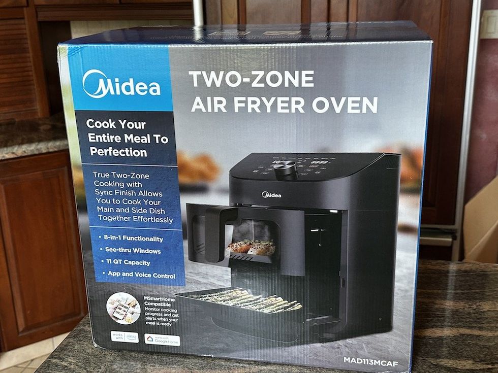 a photo of Midea Two-Zone 11QT Air Fryer box on a counter