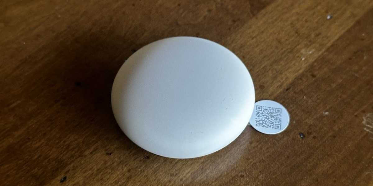 a photo of Nest Temperature Sensor (2nd Gen) on a desk.