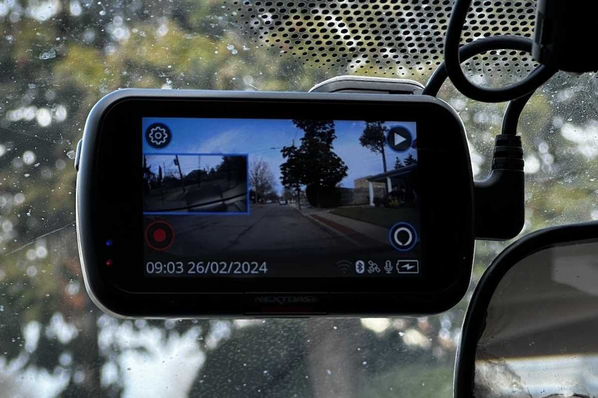 a photo of Nextbase 622GW 4K Dash Cam installed on a windshield inside a car