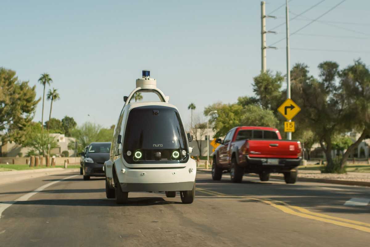 a photo of Nuro driverless vehicle on the road.