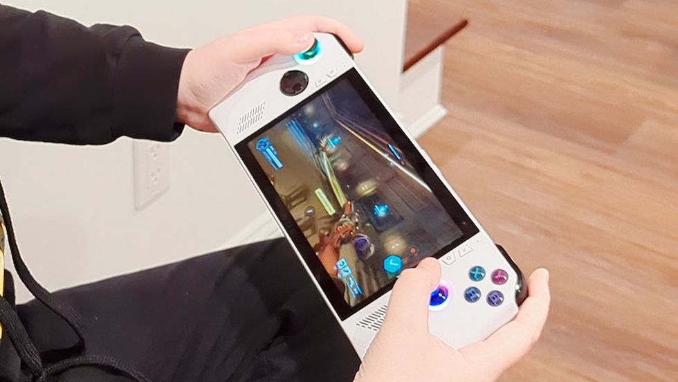 A photo of our tester playing a game on Asus ROG ALLY (RC71L) handheld gaming PC