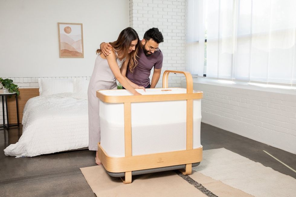 a photo of parents and Cradlewise Smart Crib