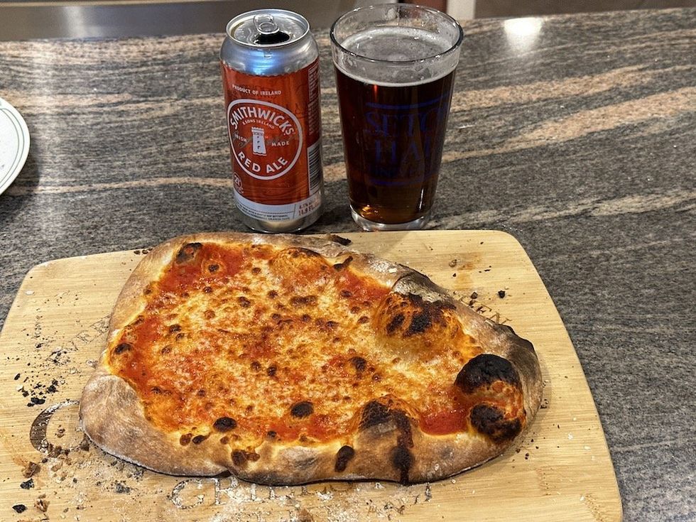 a photo of pizza and beer