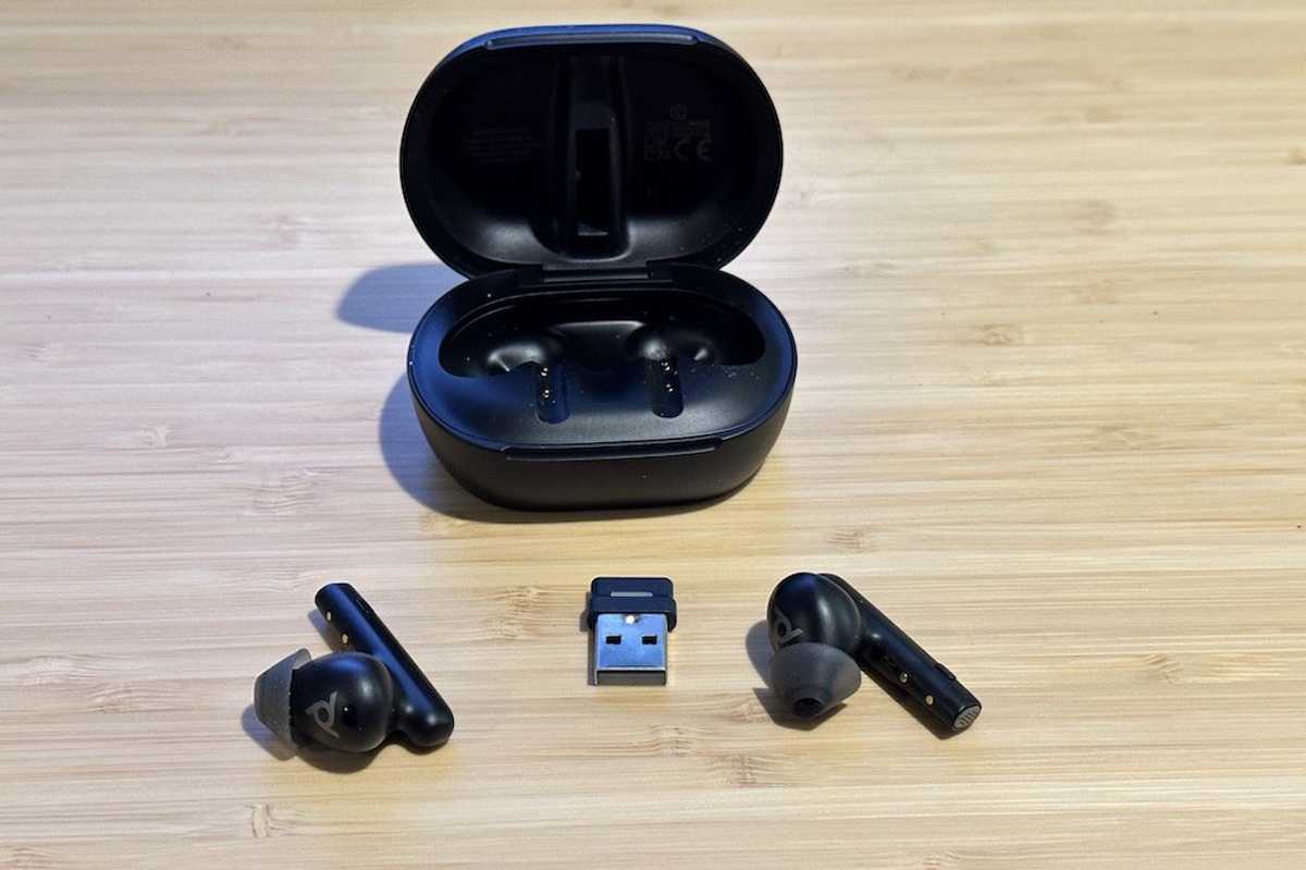 a photo of Poly Voyager Free 60+ UC Wireless Earbuds with Touchscreen Charging Case and BT700 Bluetooth Adapater