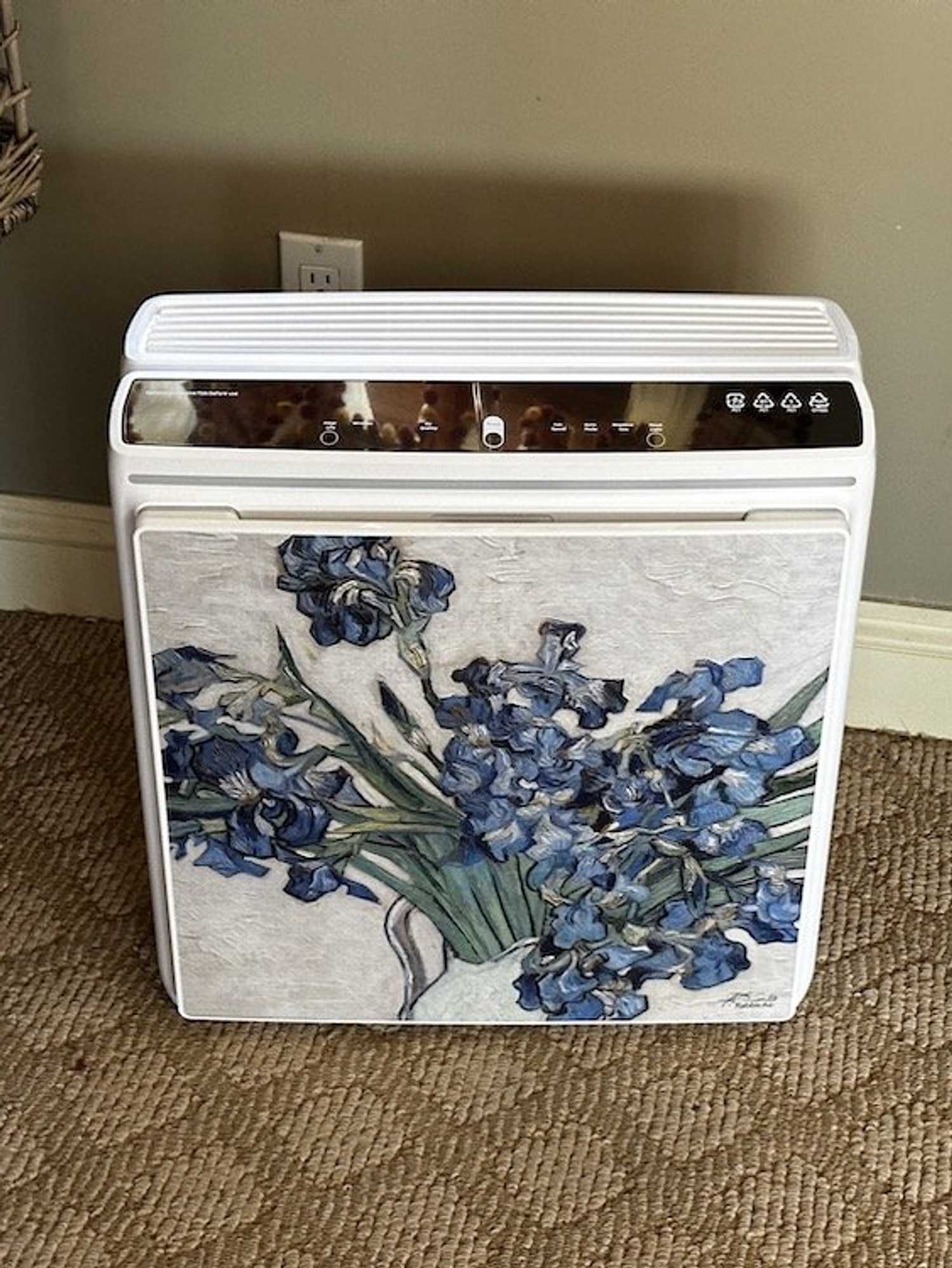 a photo of Rabbit Air A3 air purifier plugged in on the floor