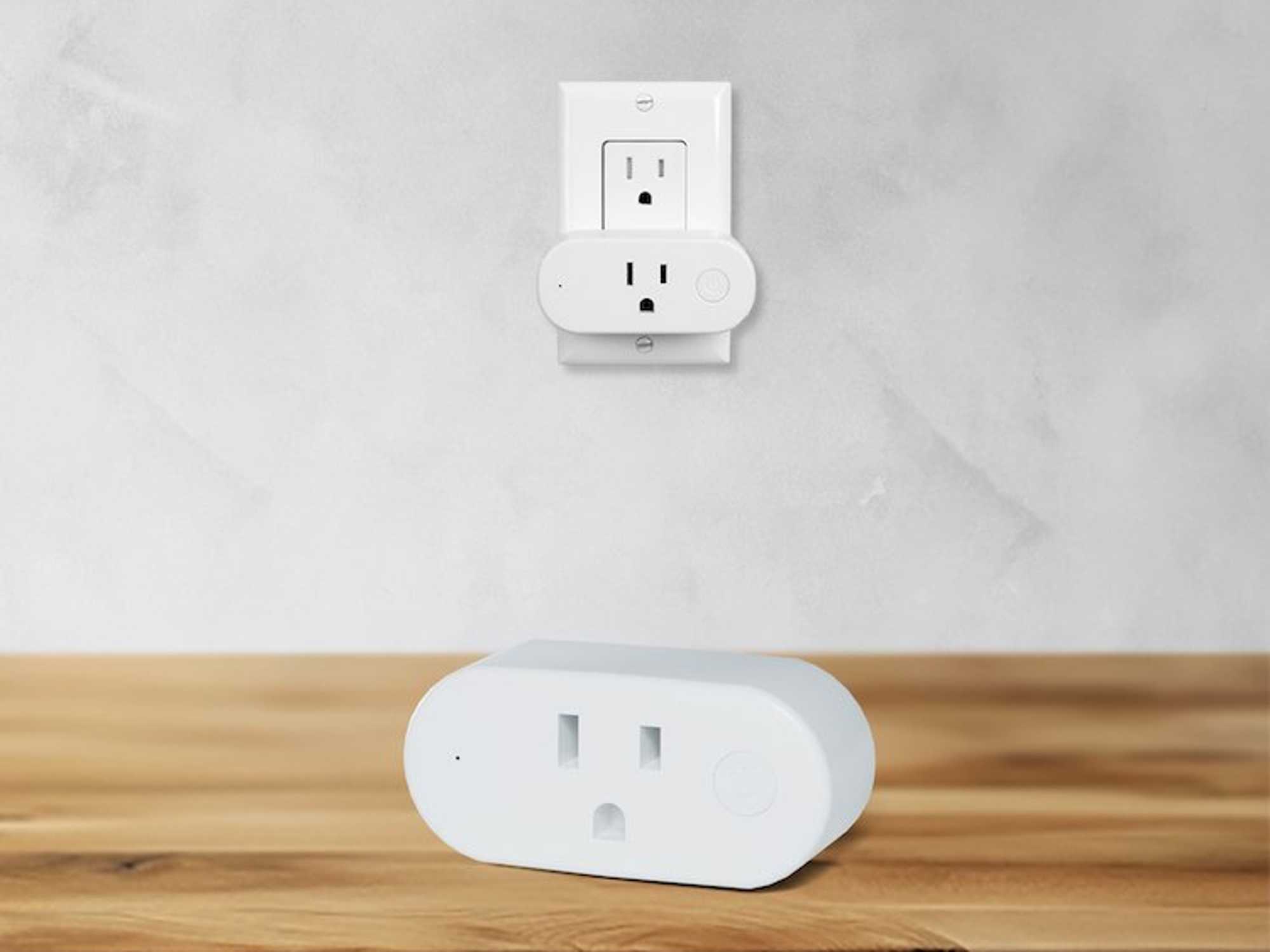 a photo of Shelly Qubino Wave Plug US on a desk and another plugged into an outlet