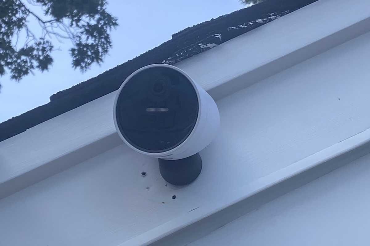 a photo of SimpliSafe Wireless Outdoor Security Camera installed on a garage.