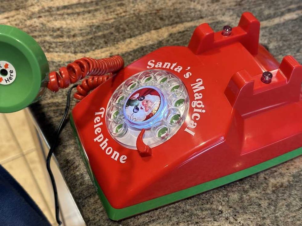 a photo of someone making a call on Santa's Magical Telephone