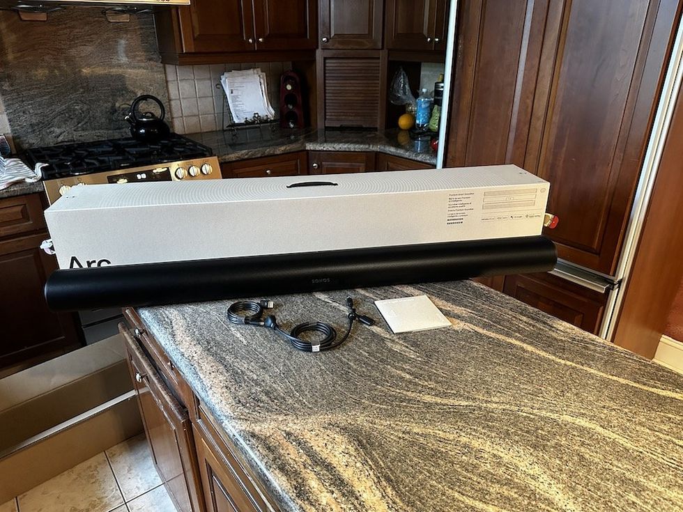 a photo of Sonos Arc Soundbar. unboxed on a countertop