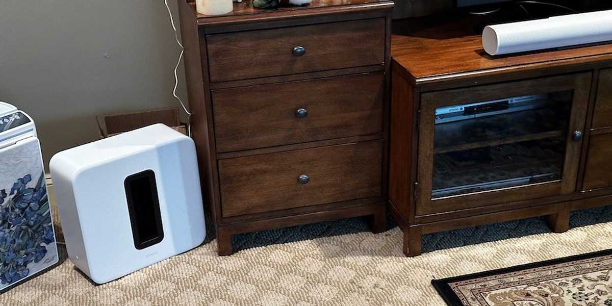 a photo of Sonos Arc Ultra soundbar and Sonos Sub 4 woofer