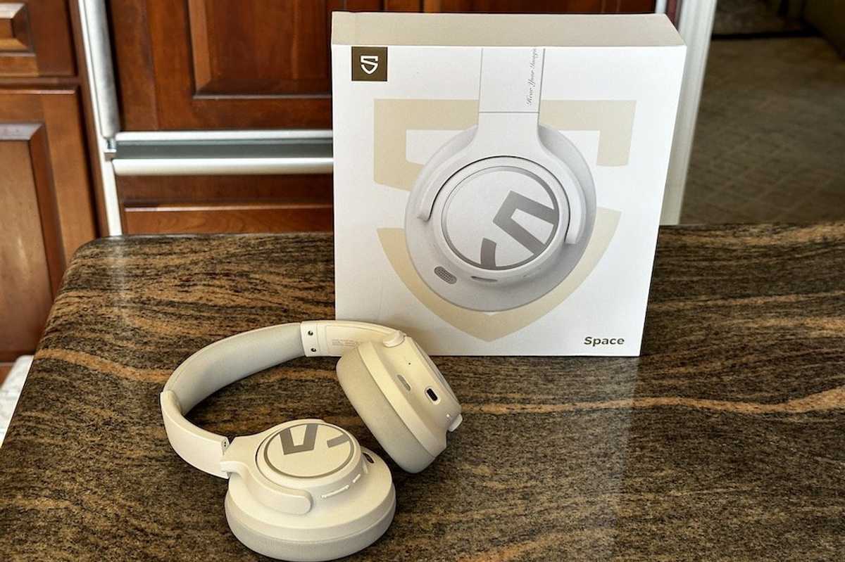 a photo of SoundPEATS Space Over-the-Ears ANC Headphones and box on a countertop.