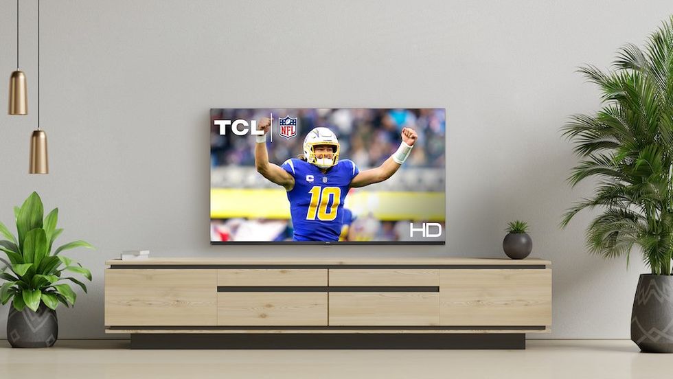 a photo of TCL tv on a wall