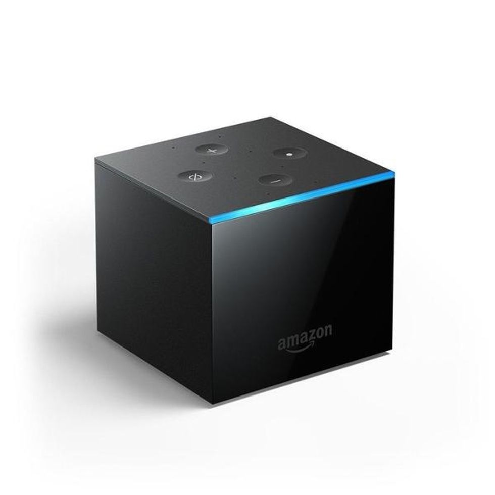 A photo of the Amazon Fire TV Cube, which can have its microphones turned off \u200bfrom a button on the top