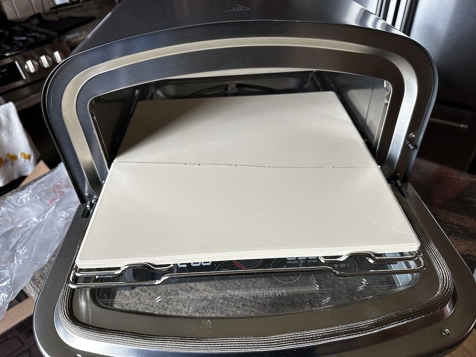 a photo of the Model P Smart Pizza Oven's pizza stone cracked.
