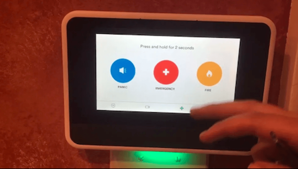 A photo of the Vivint Home Security controller on a wall