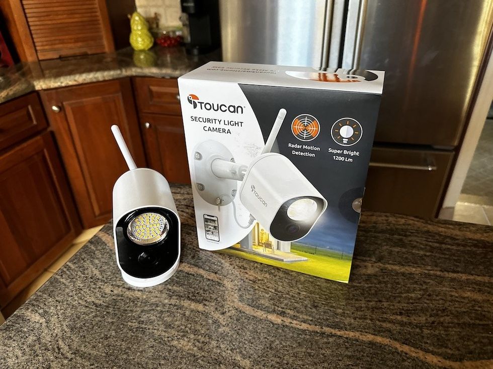 a photo of Toucan Security Light Camera and box