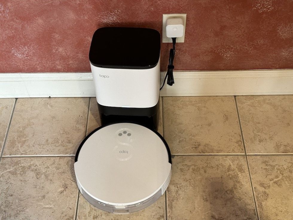 a photo of TP-Link Tapo RV10 Plus Robot Vacuum & Mop + Smart Auto-Empty Dock on the floor