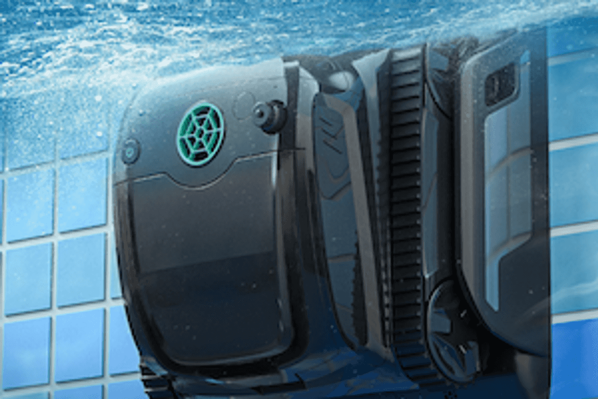 a photo of WYBOT S2 Pro Pool Cleaner on the side of a pool wall charging underwater.