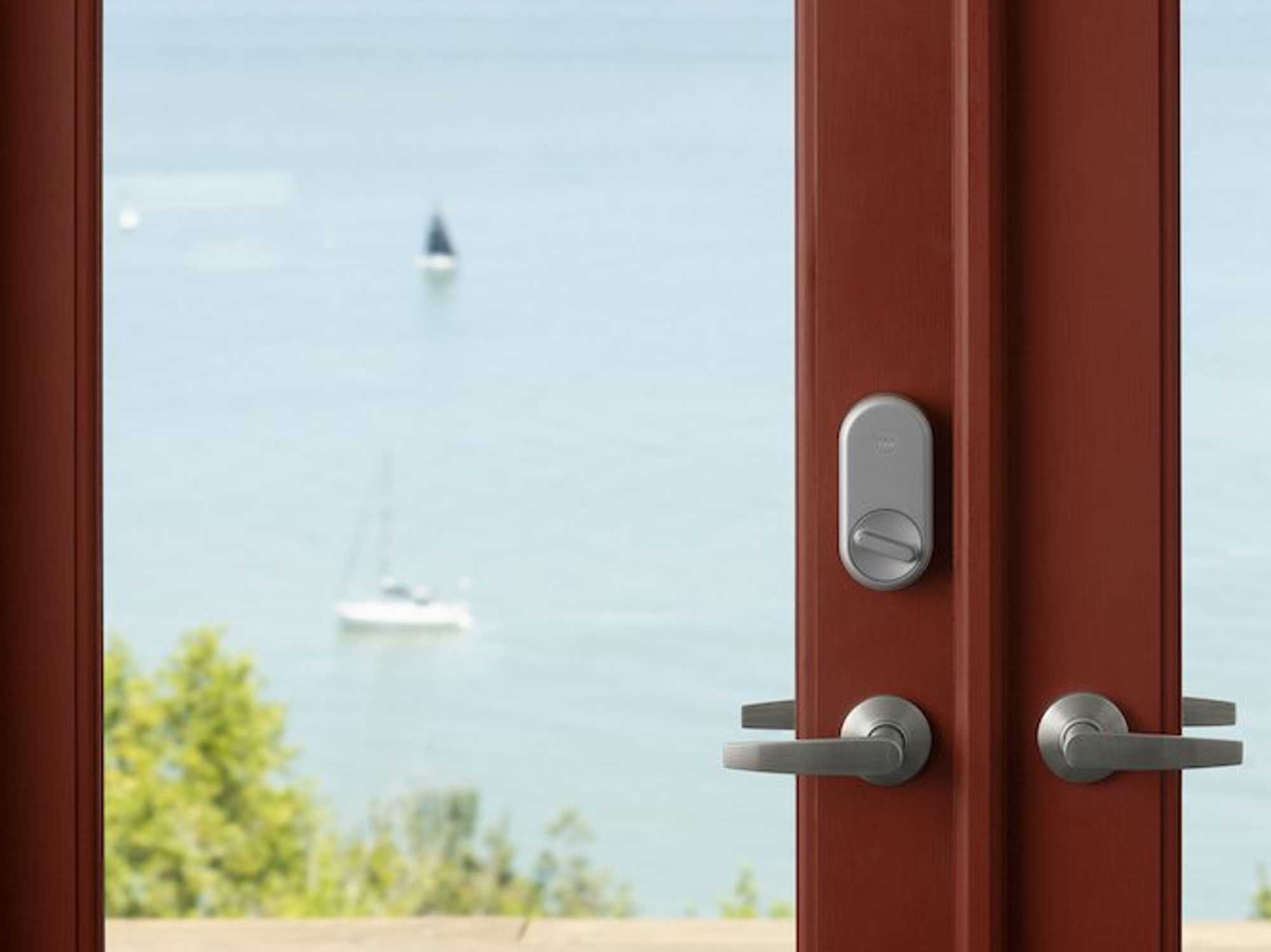 a photo of Yale Approach smart lock on a glass door.
