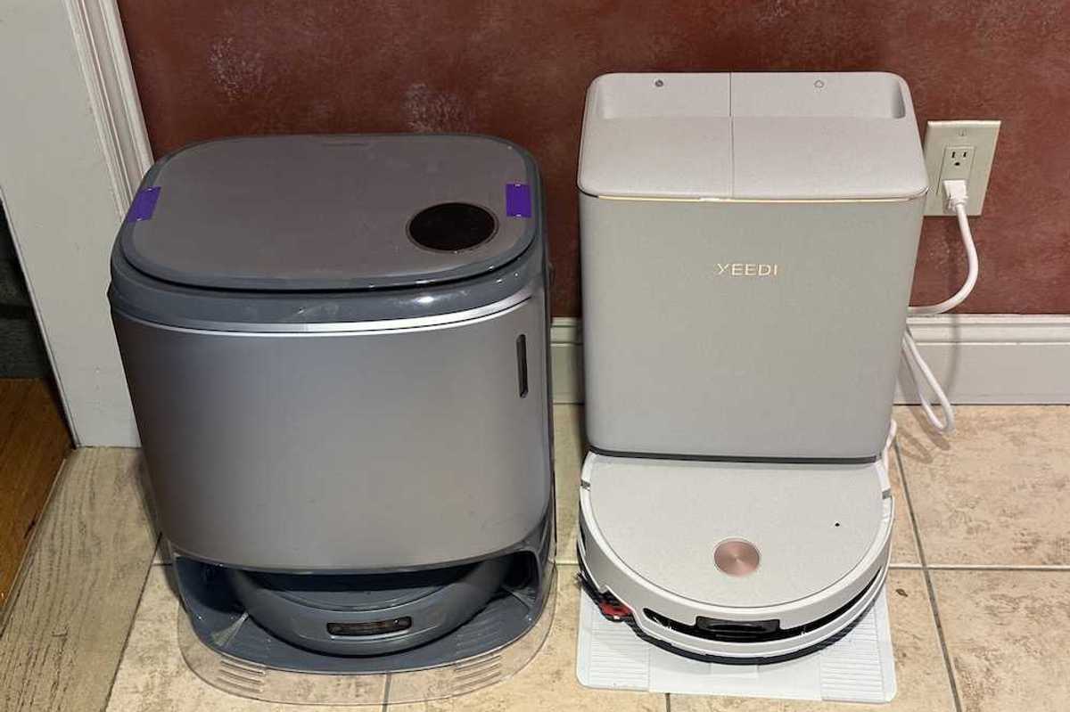 a photo of Yeedi M16 Infinity and Narwal Freo with their emptying stations.