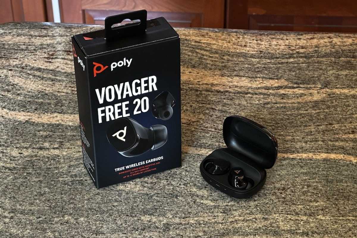 a photo ofo Poly Voyager Free 20 True Wireless Earbuds box and case opened on a counter