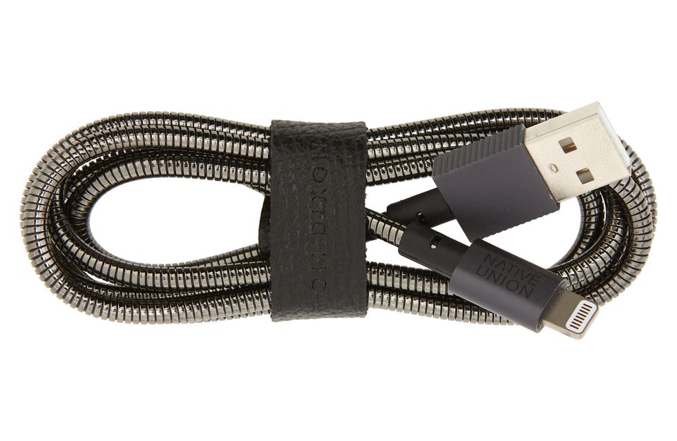 A power cord from Native Union made of steel, wrapped up against a white background