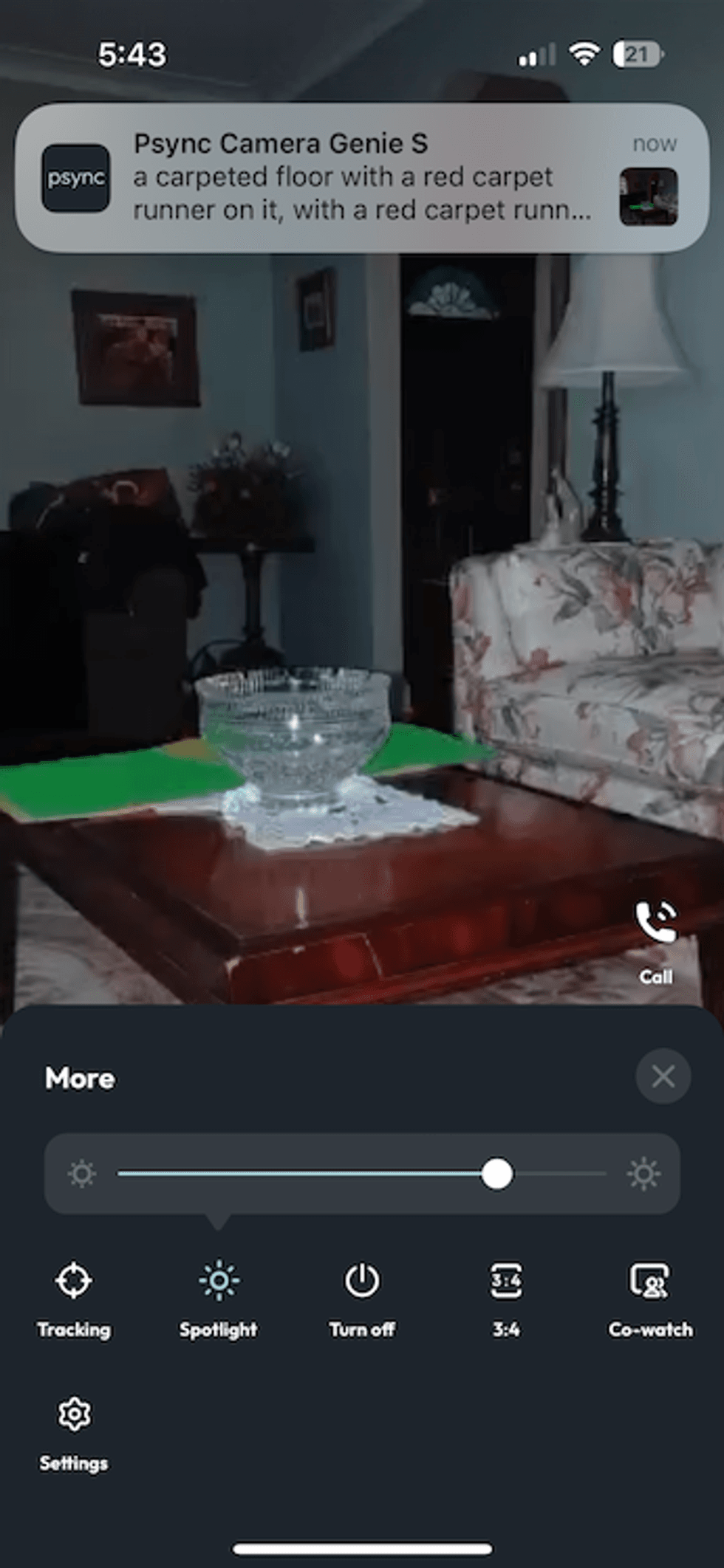 A screenshot from psync app showing live feed with controls and an alert
