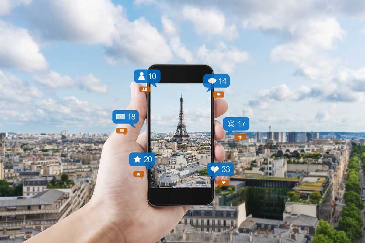 a smartphone showing Eifel Tower in Paris, France