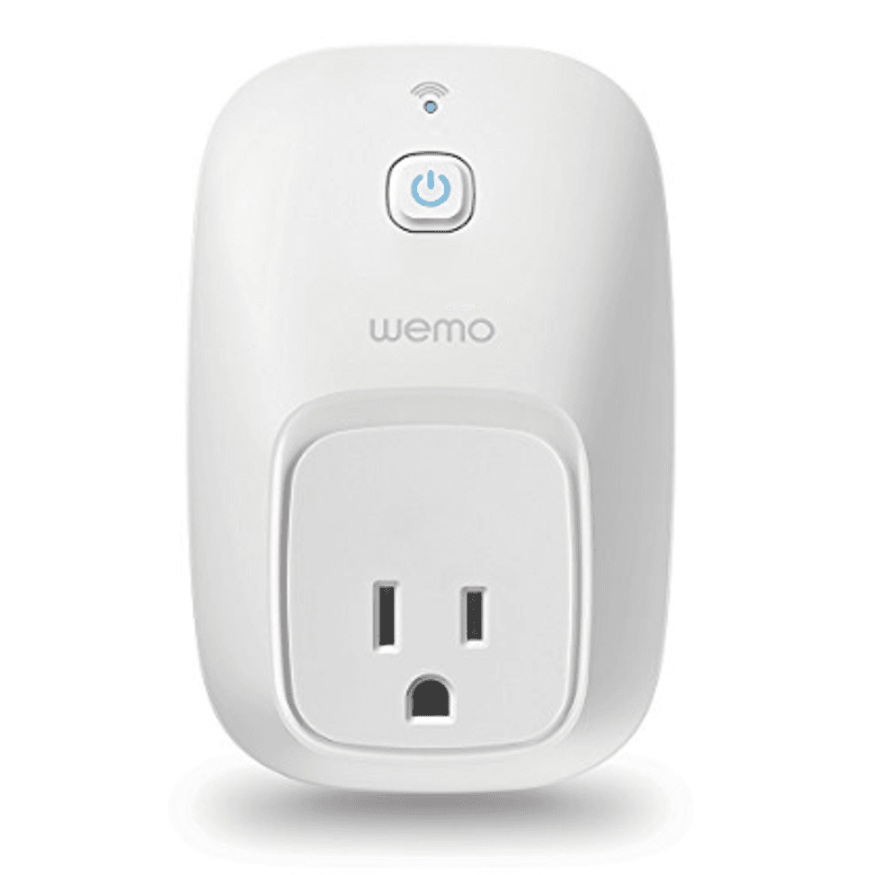 A Wemo switch and smart plug in white with a Bluetooth symbol on its top