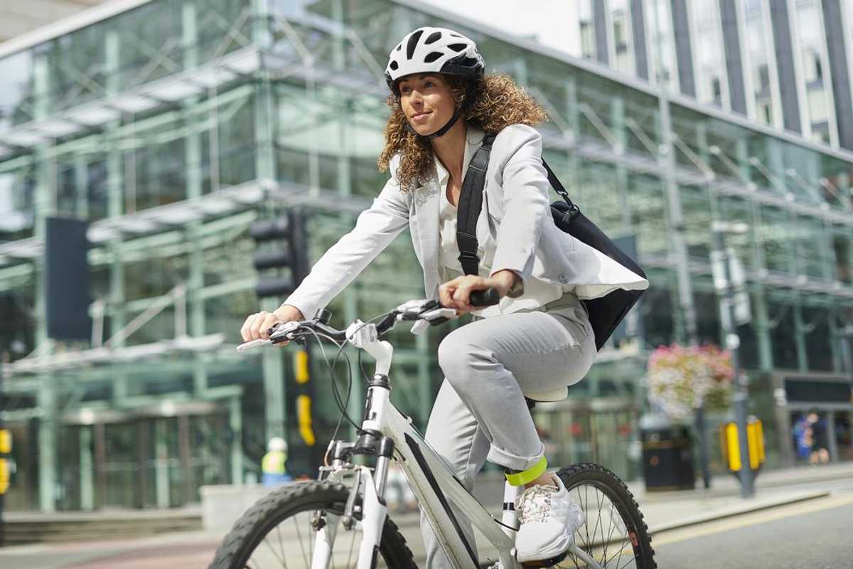a woman riding to work on a bike