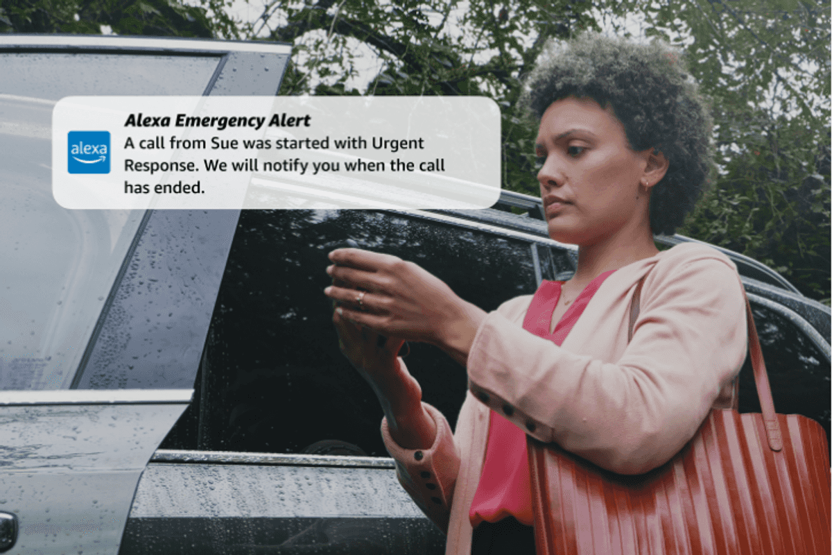 a woman viewing Alexa Emergency Alert message on her smartphone.