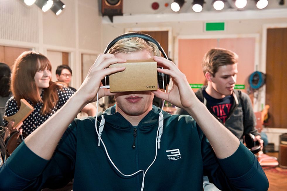 a woman wearing a tethered VR Headset