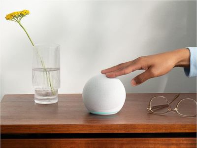 a photo of amazon echo dot 5th gen on an nightstand