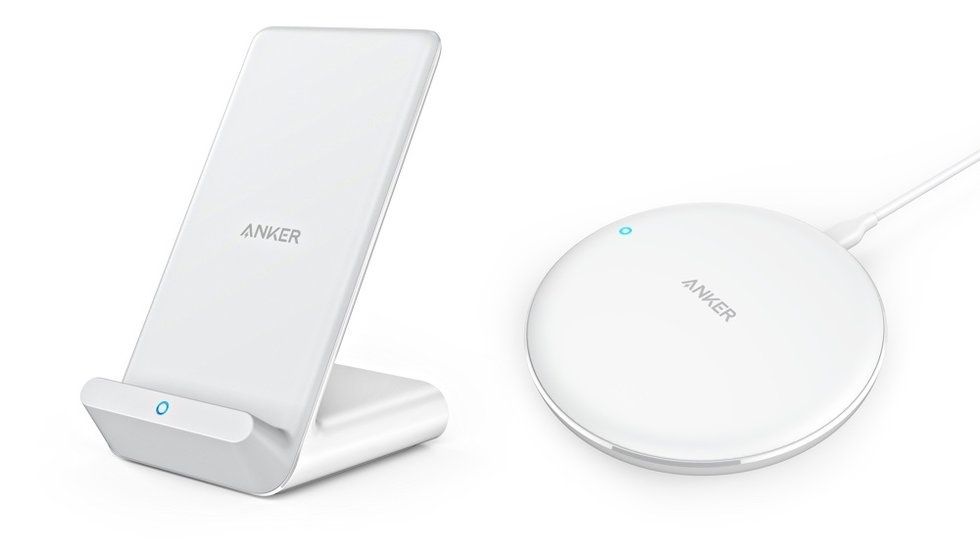An Anker power charger in white next to its charging station