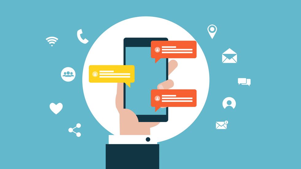 An illustration of a hand holding a smartphone