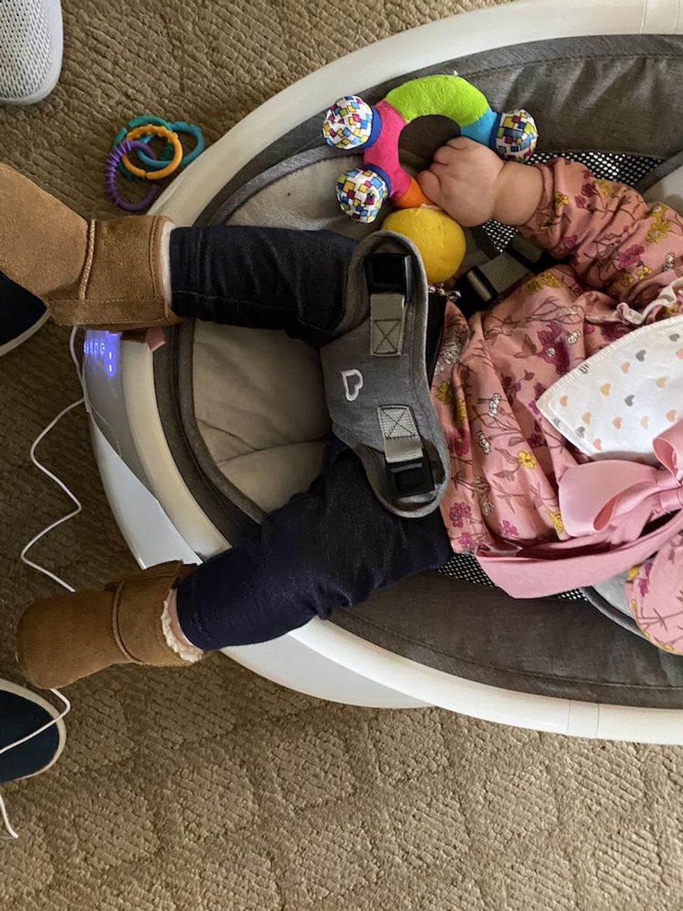 baby in infant swing