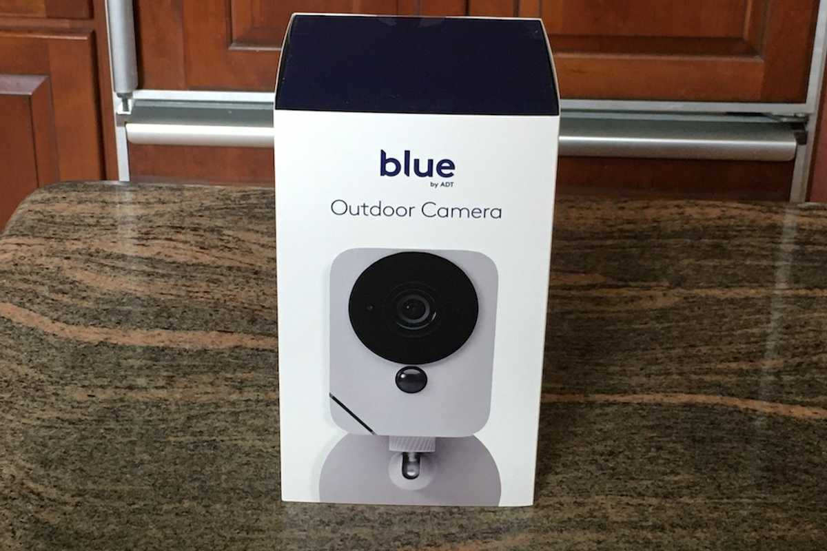 blue by adt outdoor camera in a box on a counter