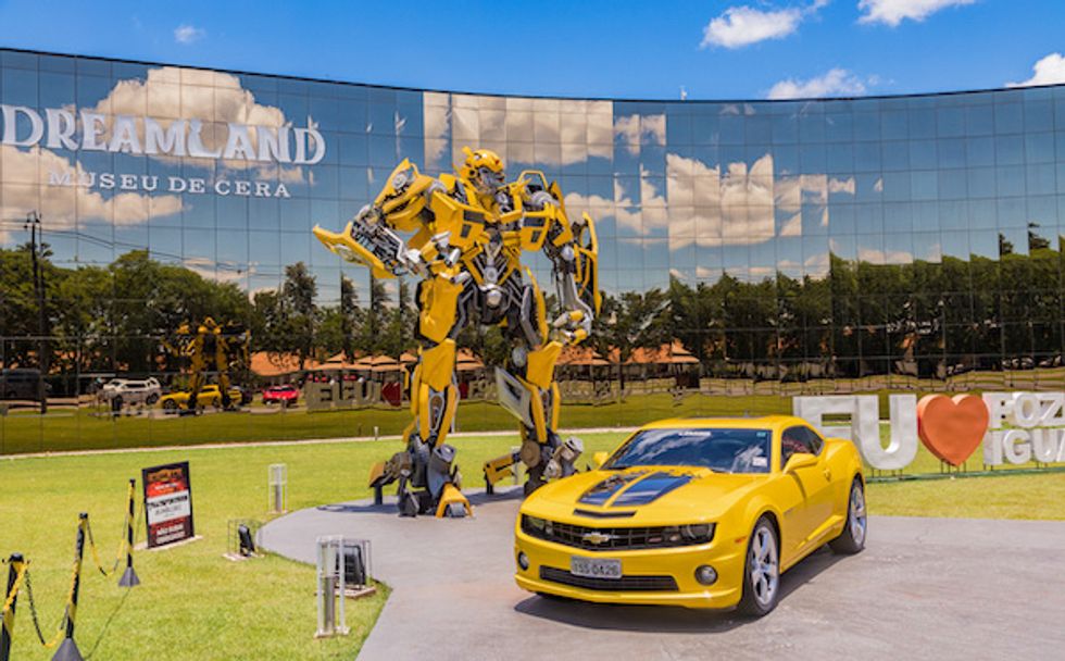 Bumblebee Transformer in front of a GM car, part of the marketing used in the "Transformers" movie series.