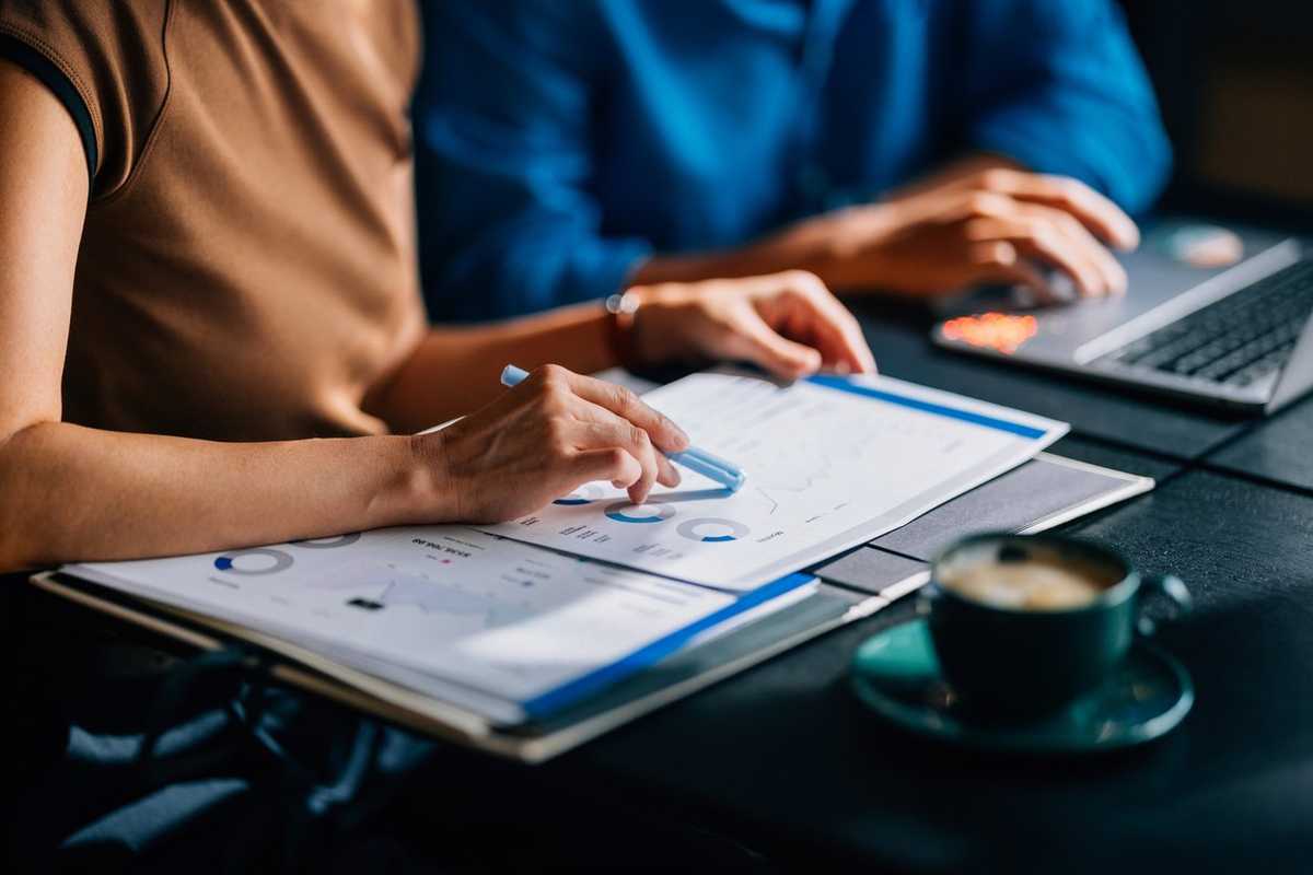 Business Team Analyzing Financial Data in Modern Office stock photo