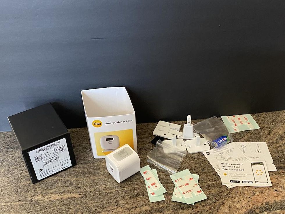 contents of Yale Smart cabinet lock on a counter.