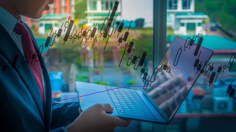 Cropped photo of businessman using laptop for analysis, chart, graph