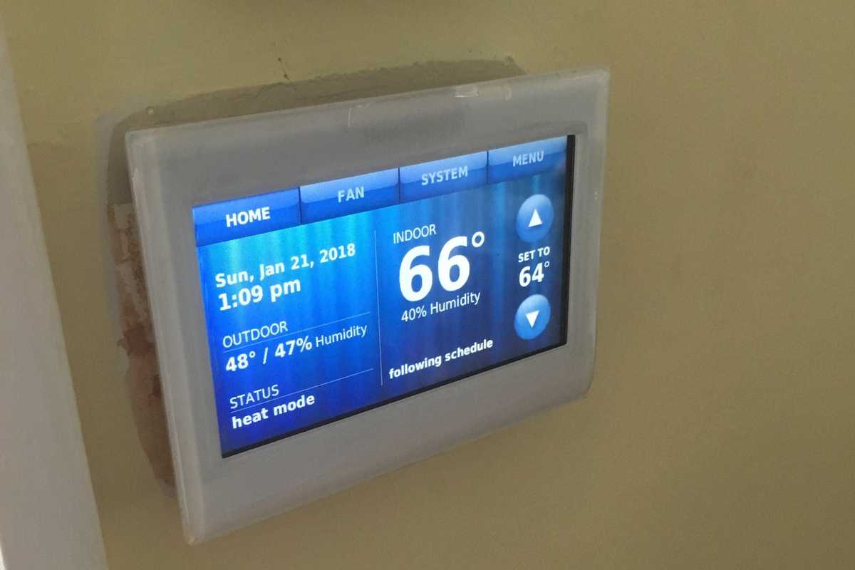Honeywell Home Color Wi-Fi Smart Thermostat on the wall.