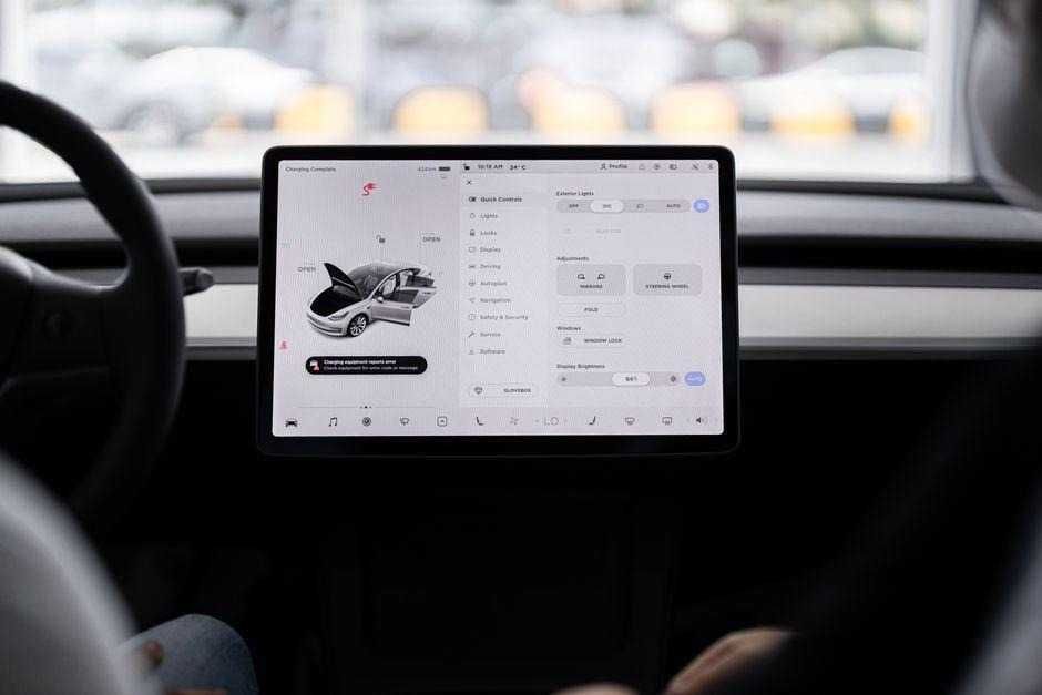 View of a modern car's dashboard featuring a digital display panel with control options.