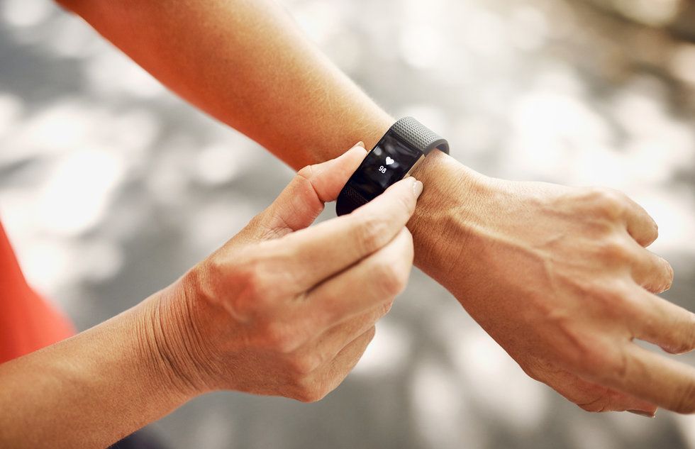 Photo of a person wearing a fitness tracker